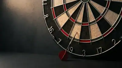 A dart fallen below a bristle dartboard after bouncing out from the wire