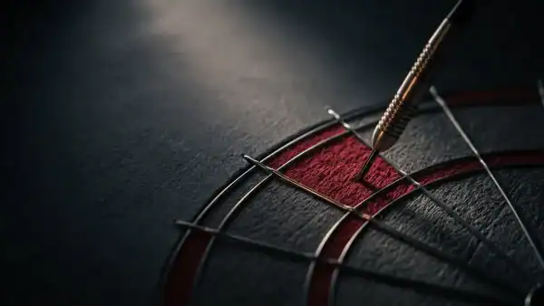 Steel-tip dart embedded in the treble 20 bed of a bristle dartboard with dramatic raking light