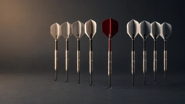 Eight tungsten darts standing upright in two facing rows representing PDC Premier League competitors